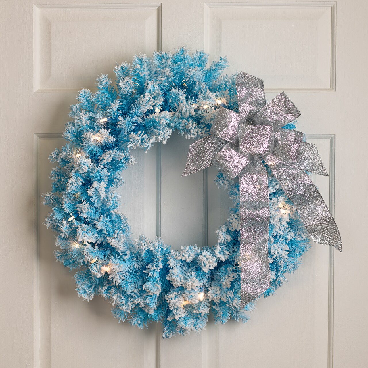 Northlight Pre-Lit Flocked Pine Artificial Christmas Wreath - 24" - Sky Blue - Clear Lights